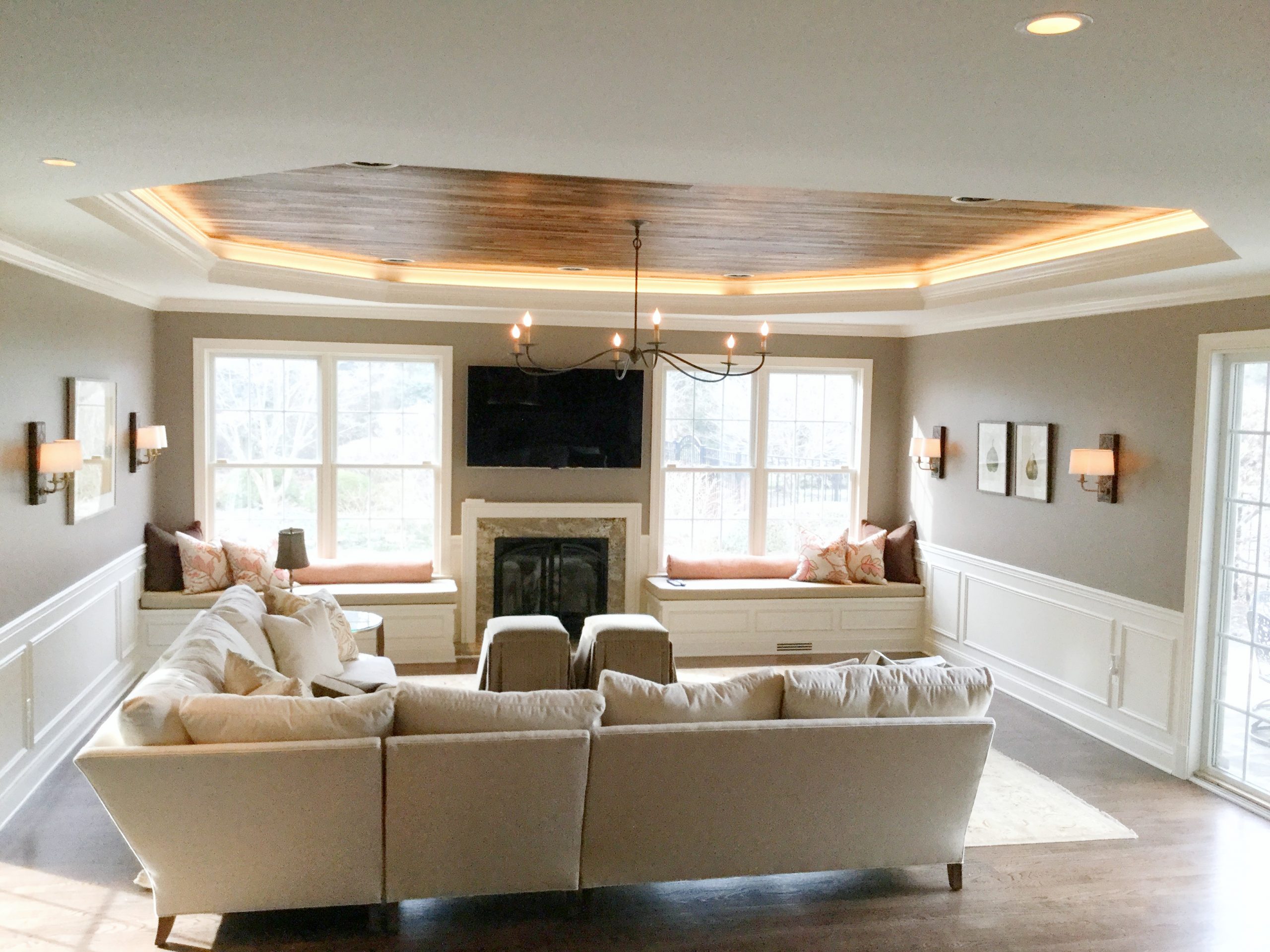 Transitional family room with black metal chandelier, hardwood ceiling and beige furniture (Different angle)