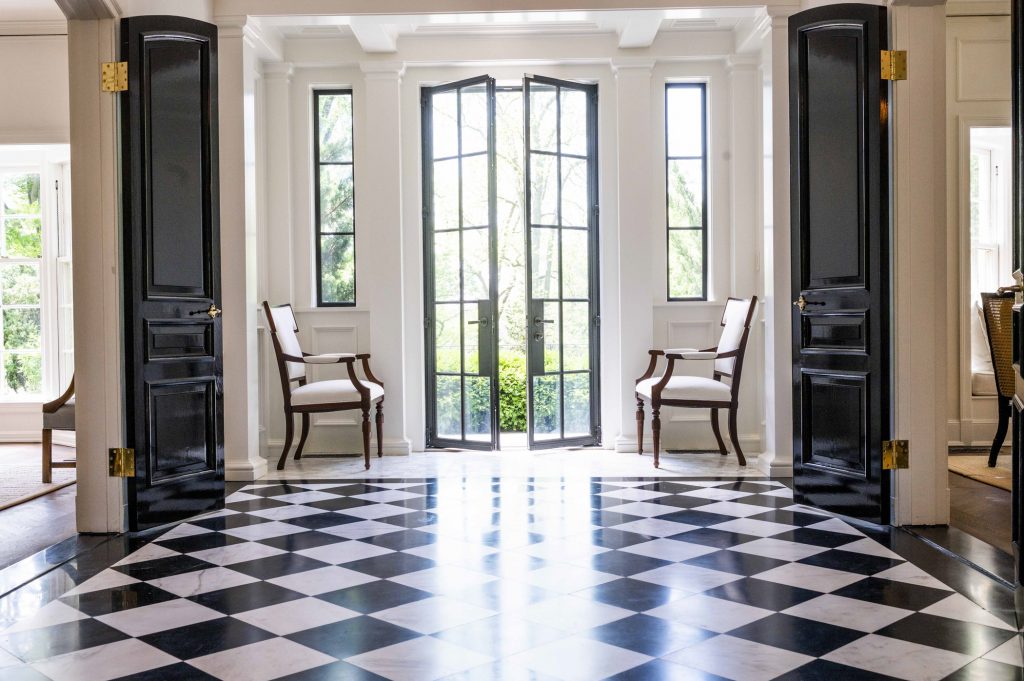 Traditional foyer with black and white checkered tile flooring (Different view)