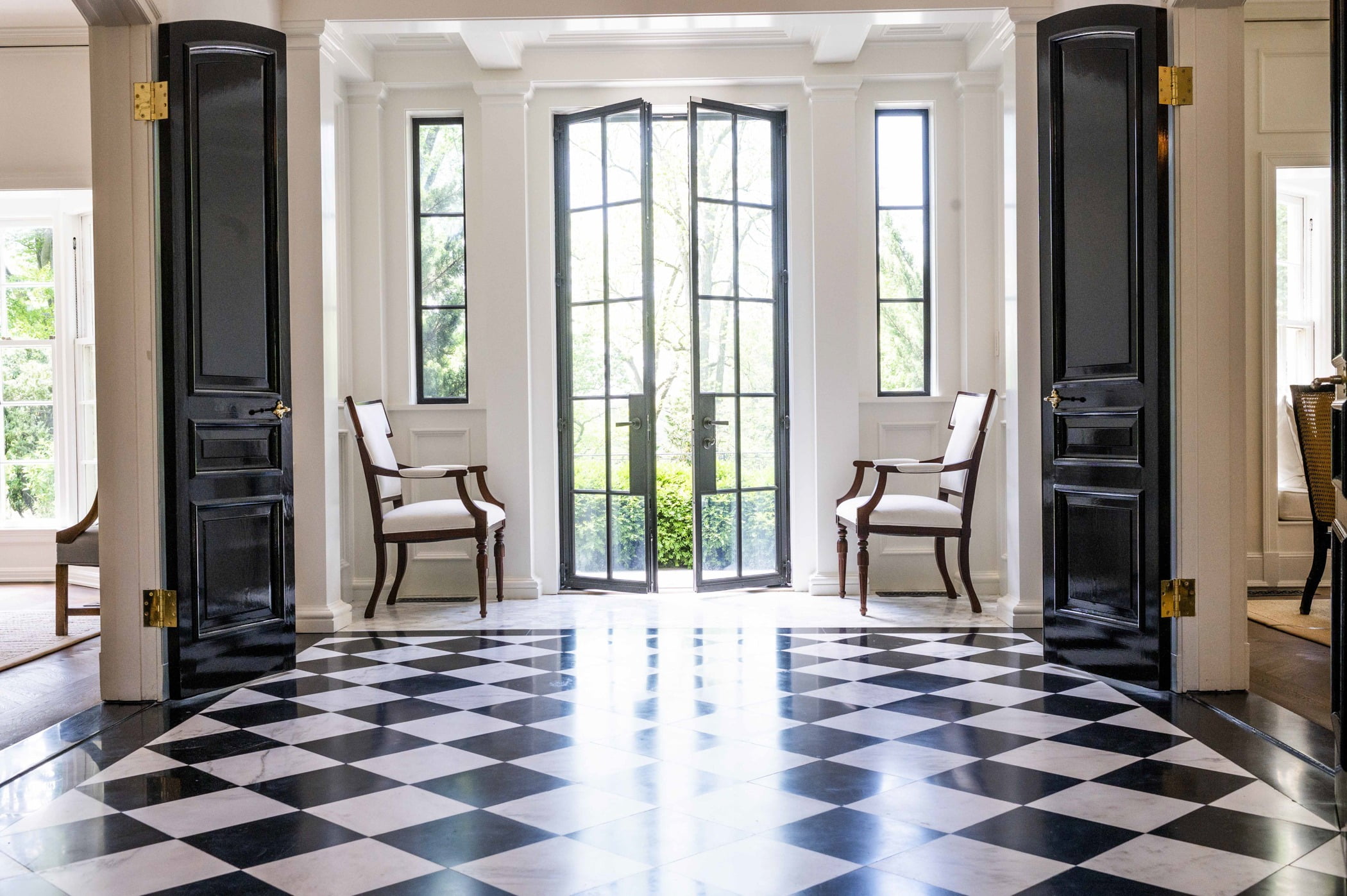 Traditional foyer with black and white checkered tile flooring (Different view)