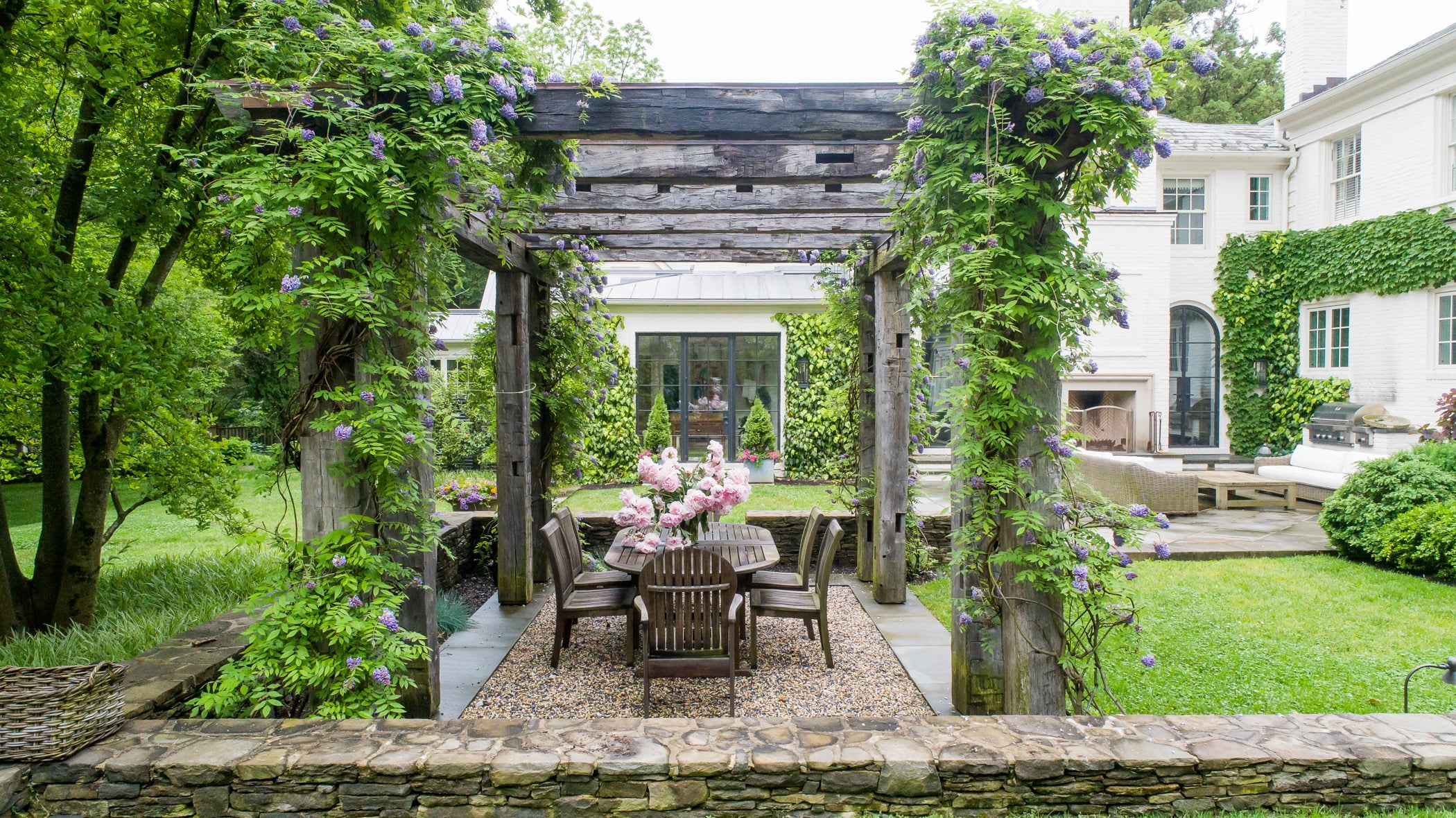 Ivy-covered wooden pergola, outdoor seating and dining area (Different view)