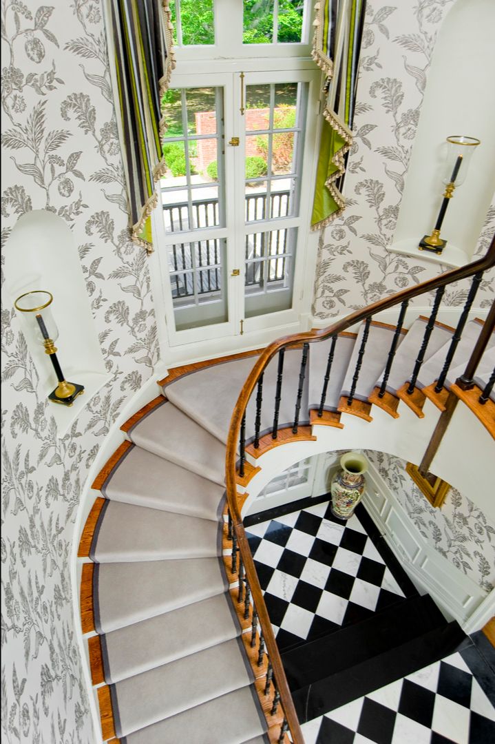 Grand staircase designed by Delbert Adams Construction Group.