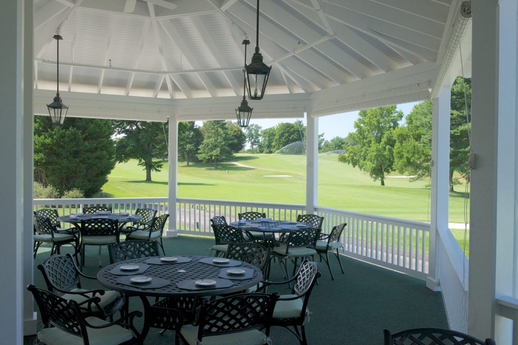 The corner porch of the Elkridge Country Club in Baltimore, Maryland renovated by Delbert Adams Construction Group, Commercial Construction division.